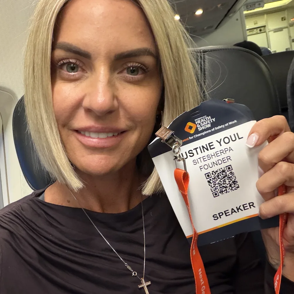 Justine Youl holding her Workplace Health and Safety Show speaker pass